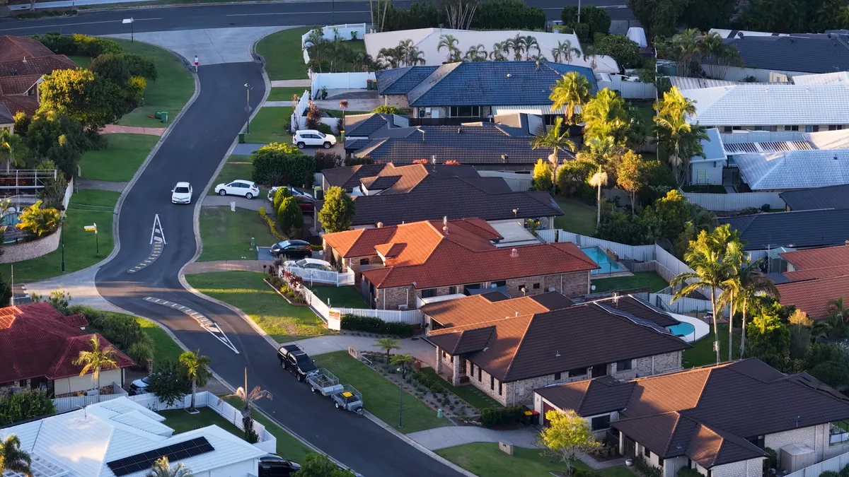 Aerial view of a leafy Australian suburb with rows of family homes