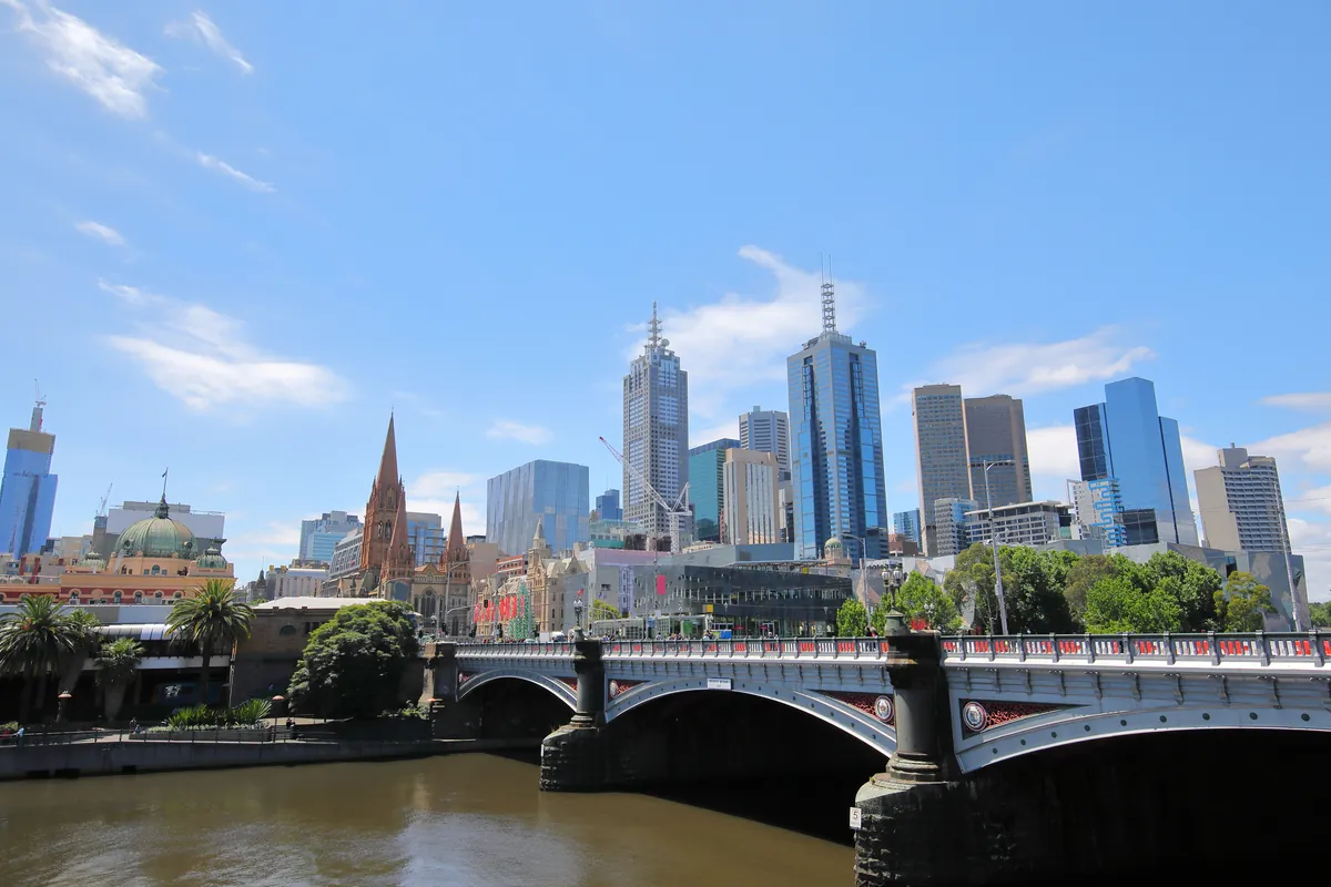 Princes Bridge over the Yarra near Flinders Street with city towers in daylight