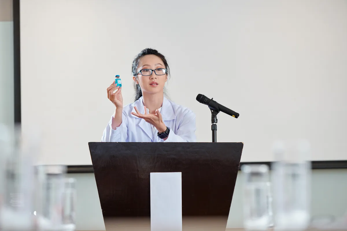 Researcher presenting findings at a podium